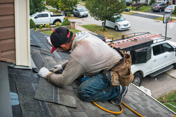 Professional Roofing technician working in West Groton, MA